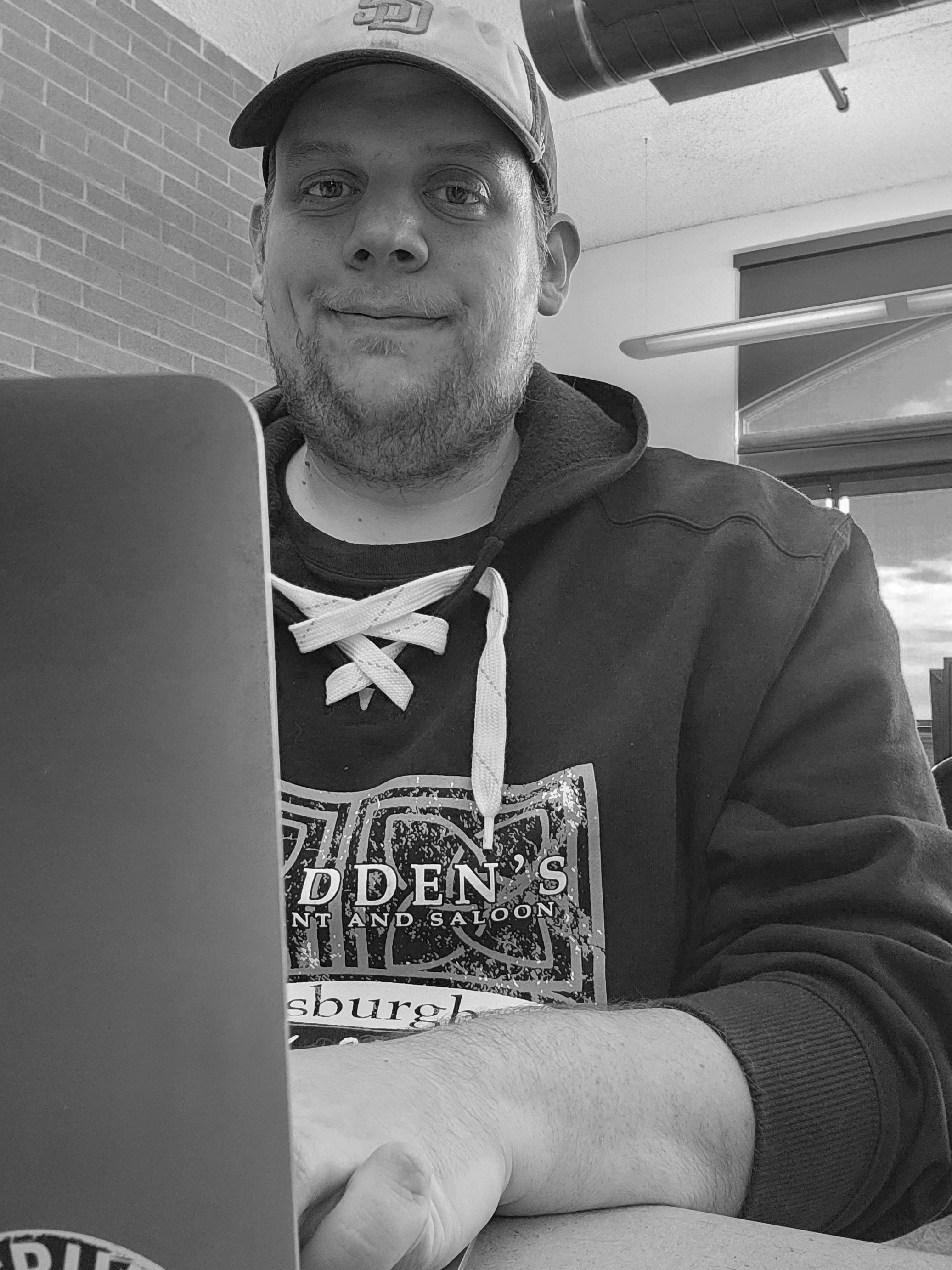 black and white profile photo of Ryan Neiderlander