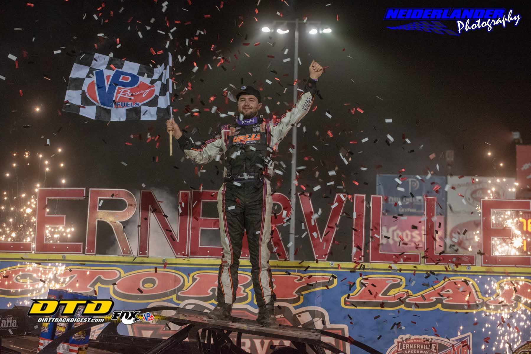 Driver Brandon Overton celebrating winning  a big race.