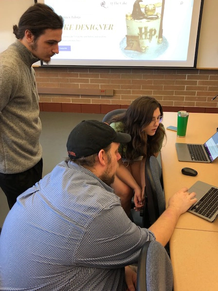 my partner and I working with our client and her website